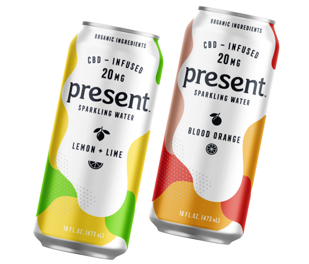 Three drink cans with various flavors and colors