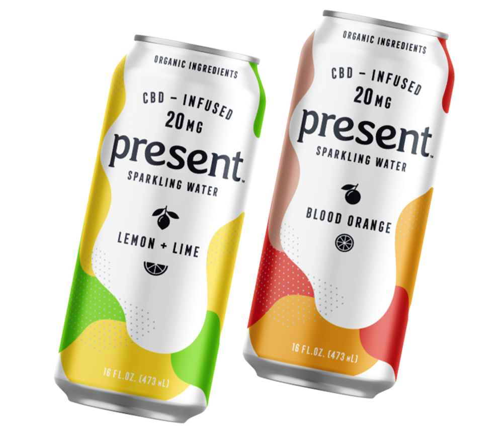 Three drink cans with various flavors and colors