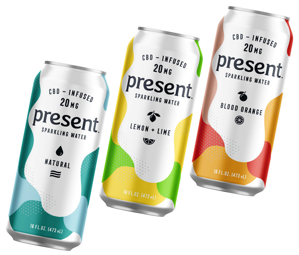 Three drink cans with various flavors and colors